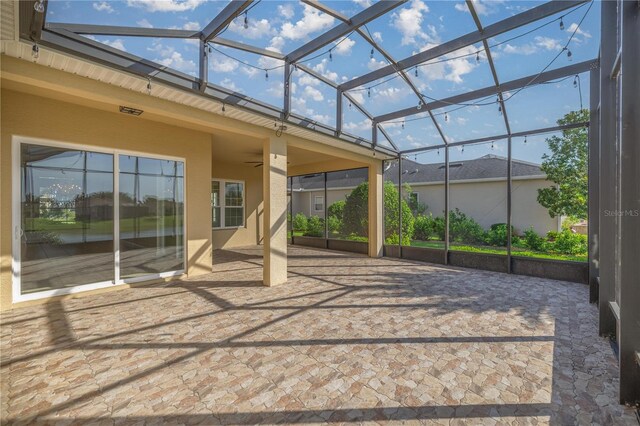 10138 Lake Miona Way, Oxford, FL 34484 - view of patio / terrace with ceiling fan and a lanai
