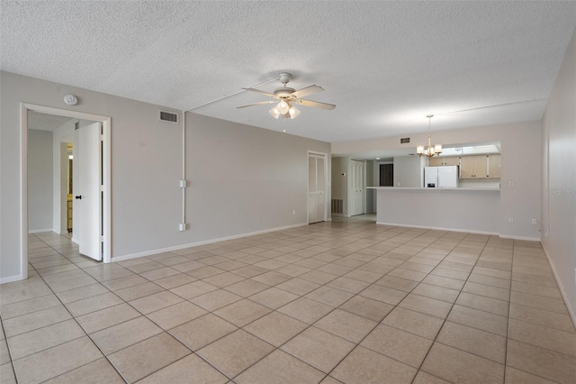 unfurnished living room featuring ceiling fan with notable chandelier, a textured ceiling, and light tile patterned flooring