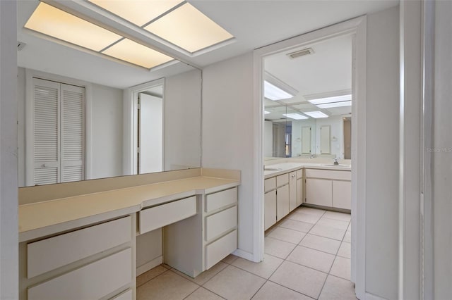 bathroom featuring tile patterned flooring and sink