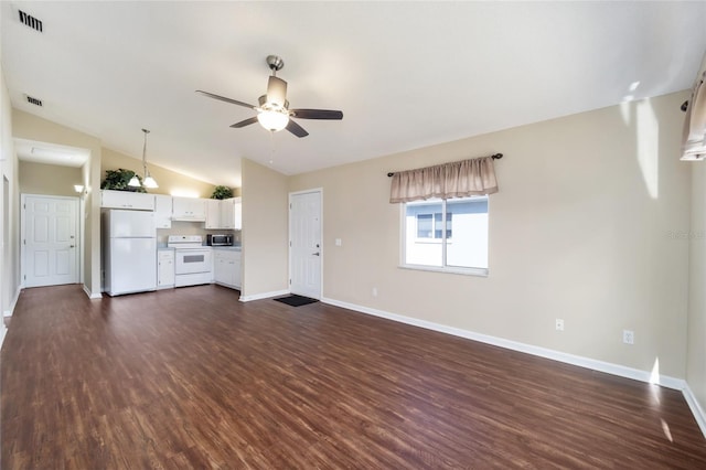 unfurnished living room with lofted ceiling, dark hardwood / wood-style floors, and ceiling fan