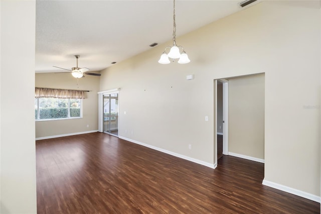 spare room featuring high vaulted ceiling, ceiling fan with notable chandelier, and dark hardwood / wood-style flooring