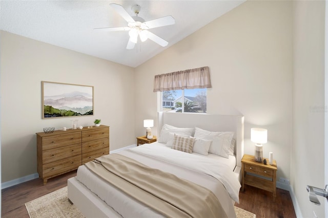 bedroom with ceiling fan, dark hardwood / wood-style floors, and vaulted ceiling