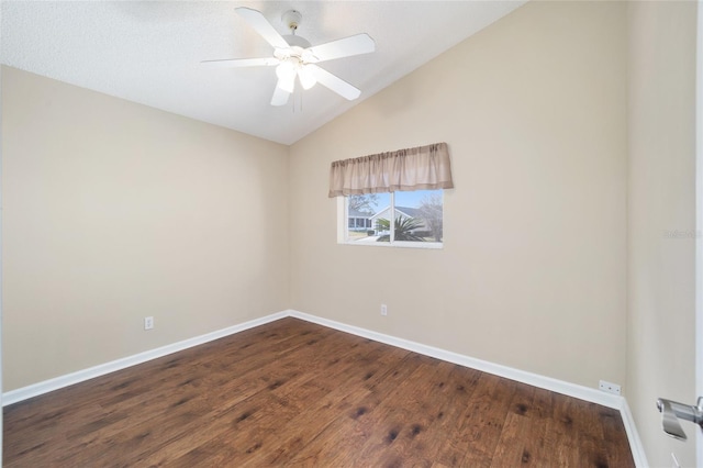 spare room featuring hardwood / wood-style flooring, ceiling fan, and vaulted ceiling