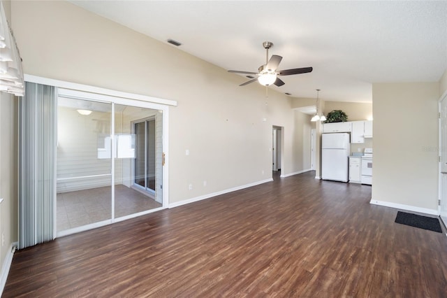 unfurnished living room with ceiling fan, lofted ceiling, and dark hardwood / wood-style flooring