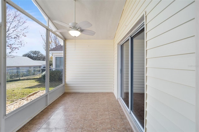 sunroom / solarium featuring a wealth of natural light and ceiling fan