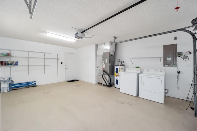 garage featuring a garage door opener, washer and clothes dryer, electric panel, electric water heater, and heating unit