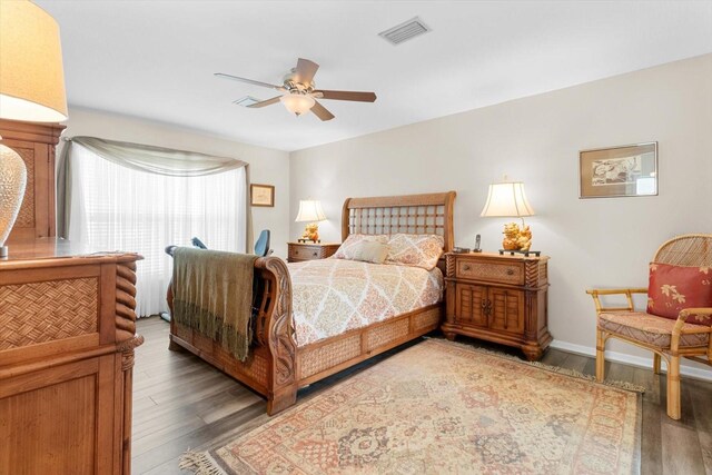 bedroom featuring ceiling fan and dark hardwood / wood-style floors