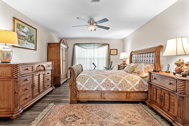 bedroom with dark wood-type flooring and ceiling fan