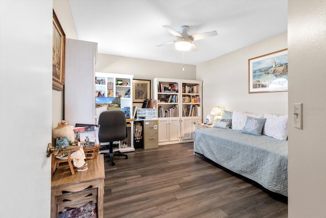 bedroom with dark hardwood / wood-style flooring and ceiling fan