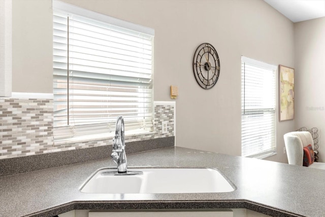 kitchen with sink and decorative backsplash