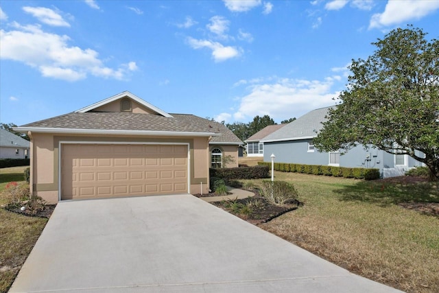 single story home with a garage and a front lawn