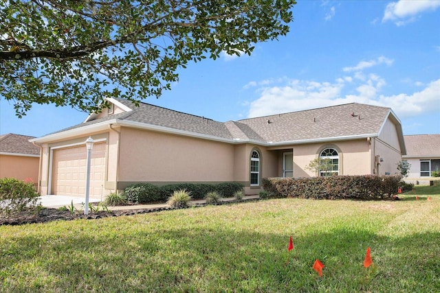 ranch-style house with a garage and a front yard