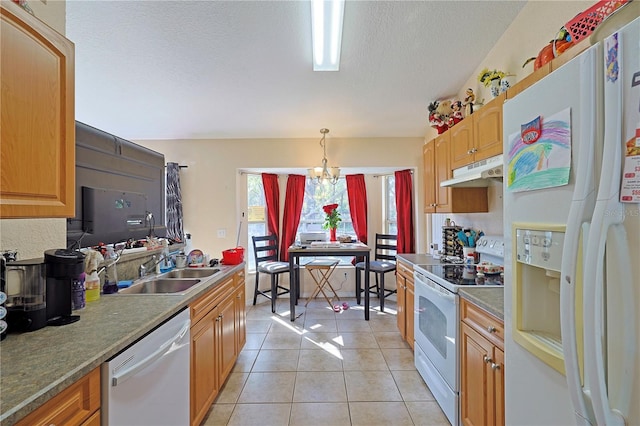 kitchen featuring hanging light fixtures, an inviting chandelier, white appliances, light tile patterned floors, and a textured ceiling