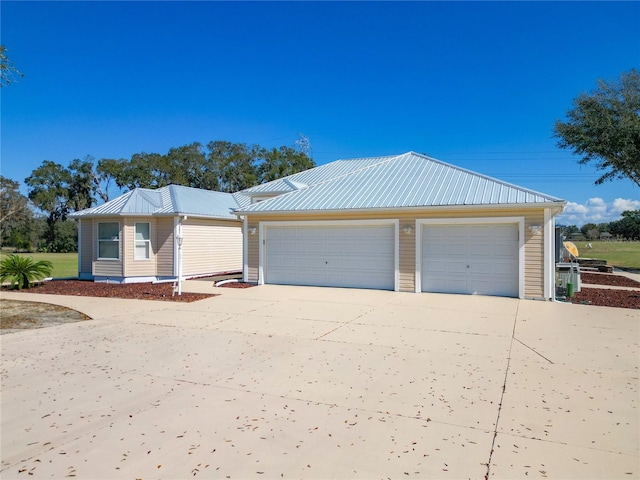 view of front of house with an outbuilding and a garage