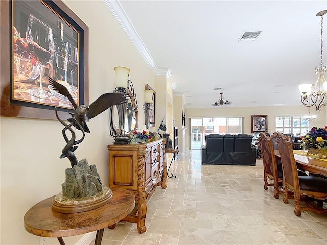 7688 SE 135th St, Summerfield, FL 34491 - hall featuring ornamental molding and a chandelier