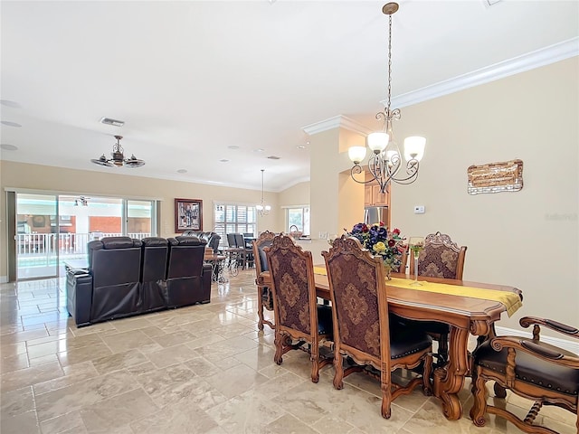 7688 SE 135th St, Summerfield, FL 34491 - dining space featuring ornamental molding and a notable chandelier