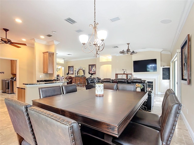 7688 SE 135th St, Summerfield, FL 34491 - dining space with ornamental molding, ceiling fan with notable chandelier, and light tile patterned floors