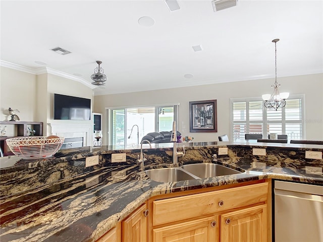 7688 SE 135th St, Summerfield, FL 34491 - kitchen with sink, hanging light fixtures, ornamental molding, stainless steel dishwasher, and an inviting chandelier
