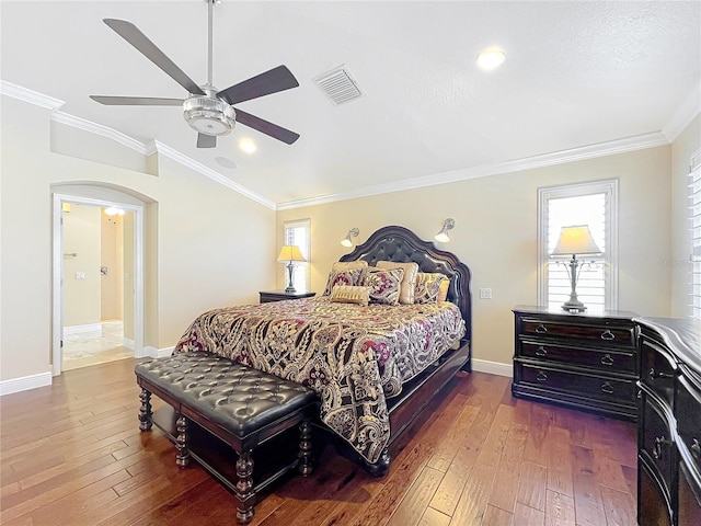 7688 SE 135th St, Summerfield, FL 34491 - bedroom featuring ornamental molding, vaulted ceiling, dark wood-type flooring, and ceiling fan