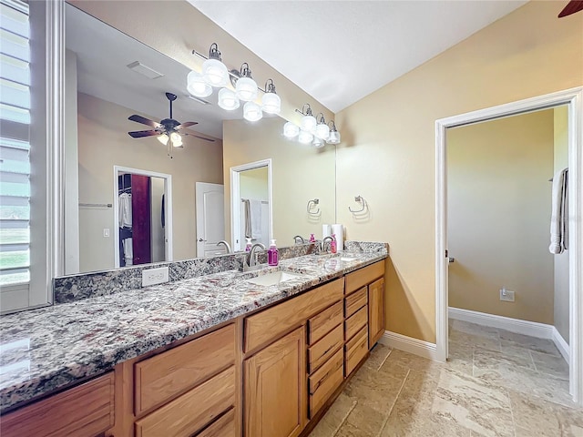 7688 SE 135th St, Summerfield, FL 34491 - bathroom featuring ceiling fan, vanity, and vaulted ceiling