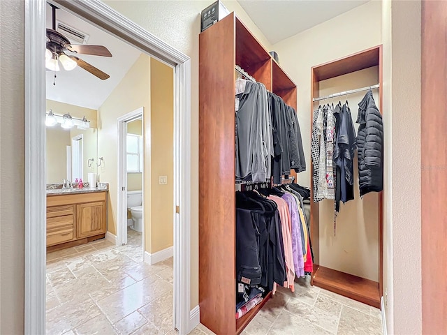 7688 SE 135th St, Summerfield, FL 34491 - walk in closet with sink, vaulted ceiling, and ceiling fan