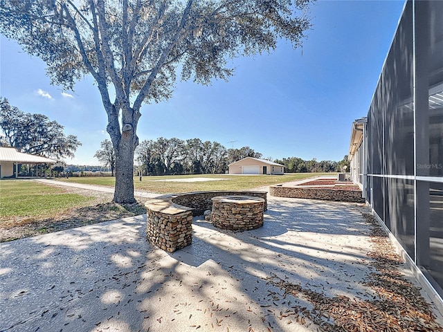 7688 SE 135th St, Summerfield, FL 34491 - view of patio / terrace with a fire pit
