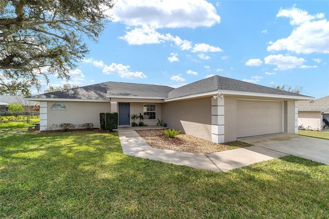 view of front of home featuring a garage and a front yard