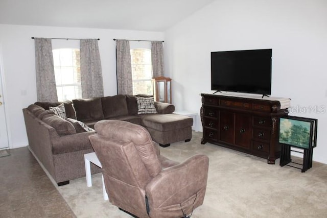 living room featuring plenty of natural light, light colored carpet, and lofted ceiling