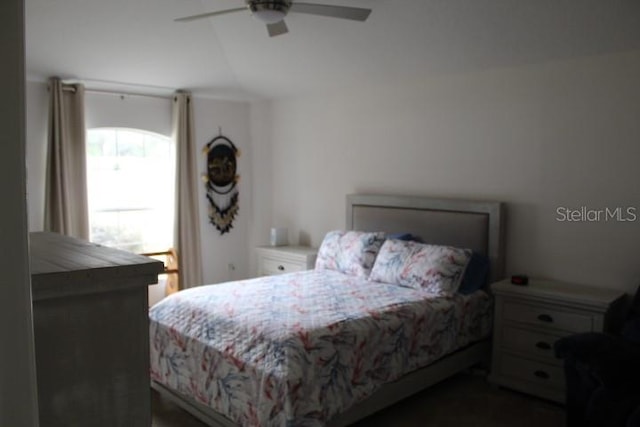 bedroom featuring vaulted ceiling and ceiling fan