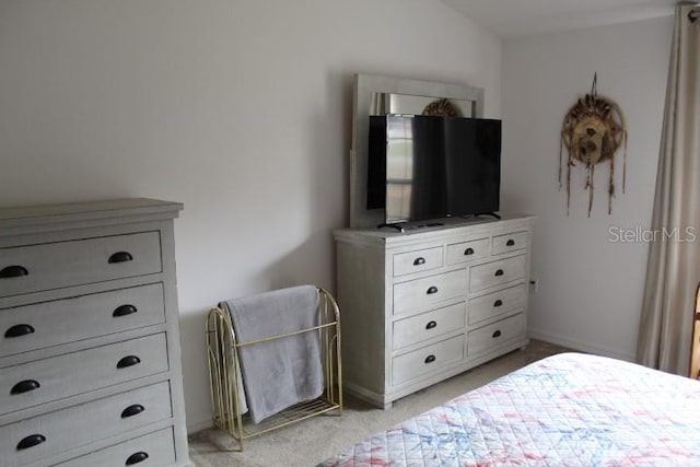 bedroom with light colored carpet