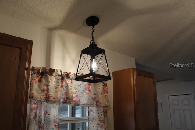 interior details featuring a textured ceiling