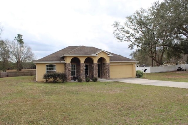 view of front of property with a garage and a front yard