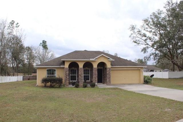 view of front of property featuring a garage and a front yard