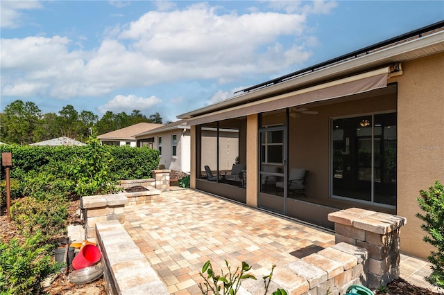 view of patio / terrace featuring ceiling fan