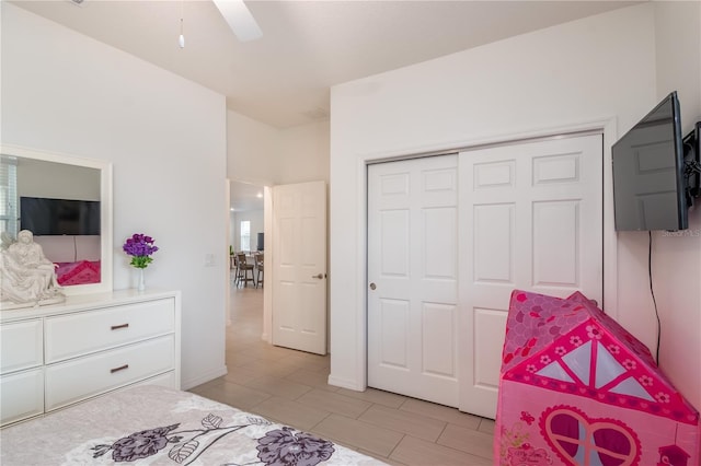 bedroom featuring ceiling fan and a closet