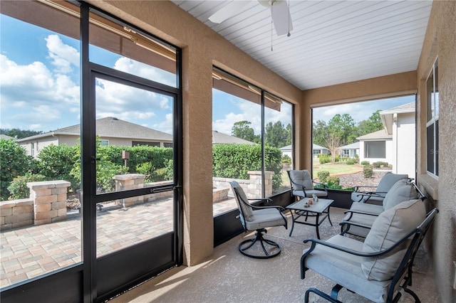 sunroom / solarium with ceiling fan