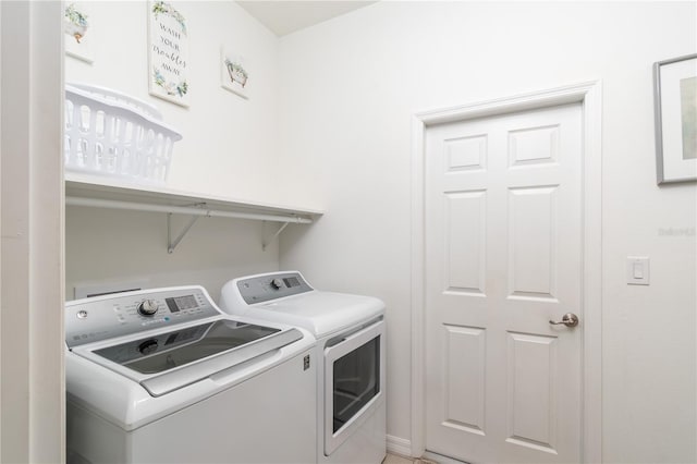 washroom featuring washer and dryer