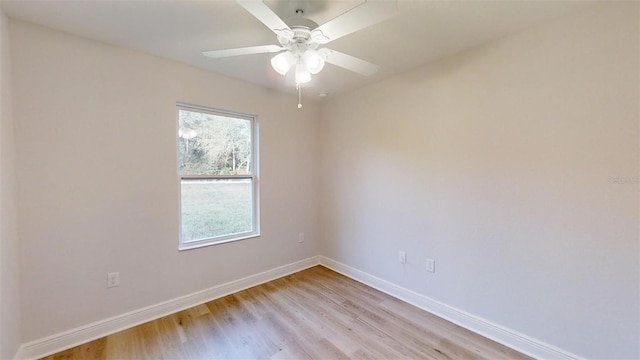 empty room with ceiling fan and light wood-type flooring