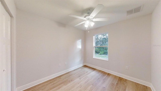 spare room featuring light hardwood / wood-style flooring and ceiling fan