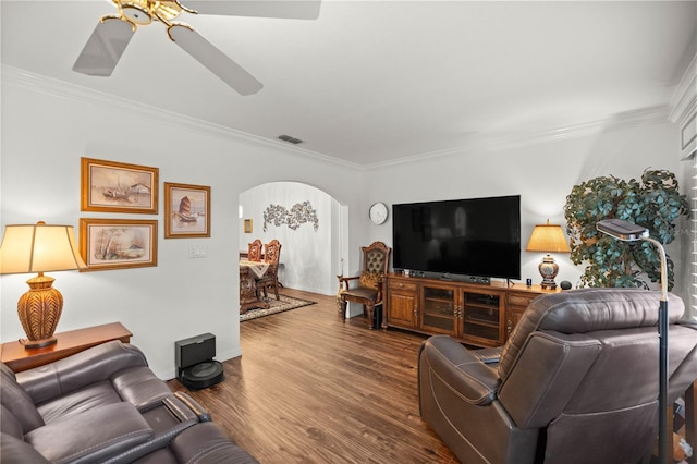 living room with ceiling fan, ornamental molding, and hardwood / wood-style floors