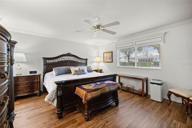 bedroom with hardwood / wood-style flooring and ornamental molding