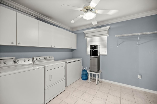 clothes washing area with light tile patterned floors, crown molding, washer and clothes dryer, ceiling fan, and cabinets