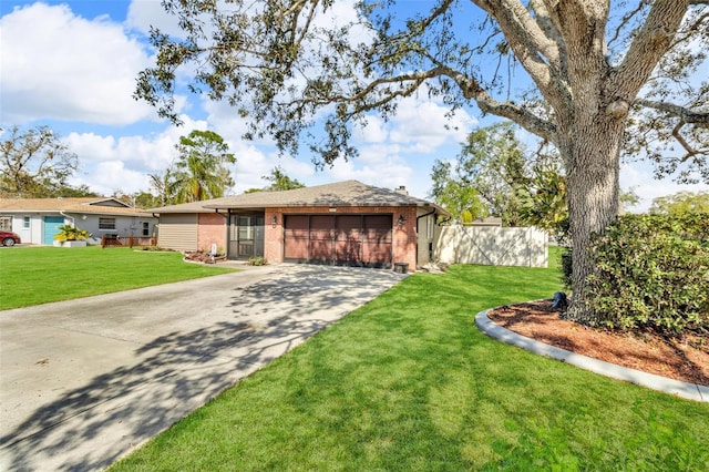 ranch-style home featuring a garage and a front yard