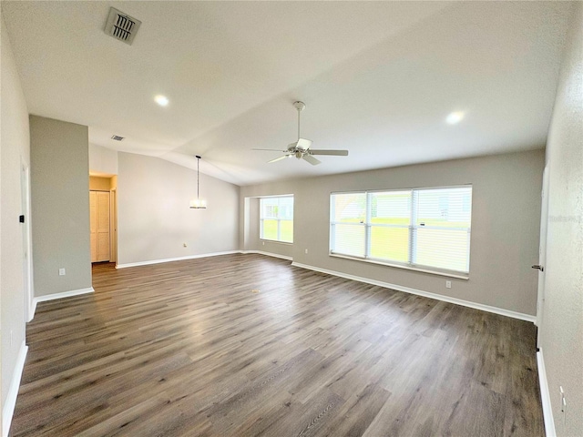 spare room with ceiling fan, lofted ceiling, and dark hardwood / wood-style floors