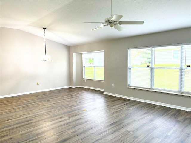 unfurnished living room with ceiling fan, lofted ceiling, a textured ceiling, and dark hardwood / wood-style flooring