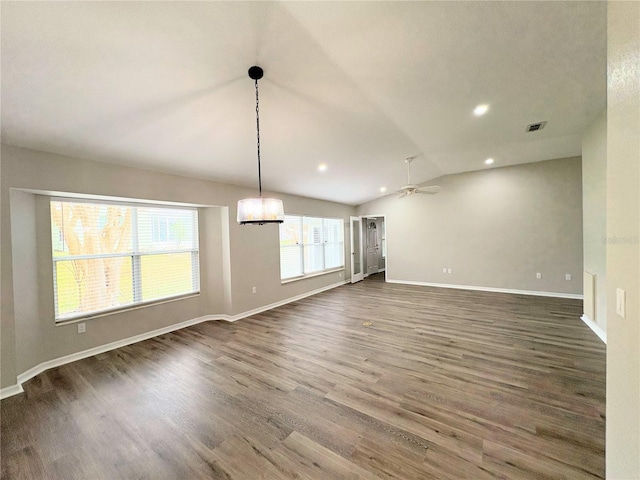 interior space with vaulted ceiling, ceiling fan, and dark hardwood / wood-style flooring