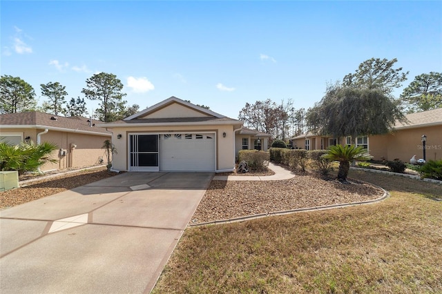 9126 SW 102nd Cir, Ocala, FL 34481 - ranch-style home featuring driveway, an attached garage, and stucco siding