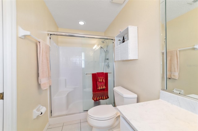 bathroom with recessed lighting, toilet, a shower stall, vanity, and tile patterned flooring