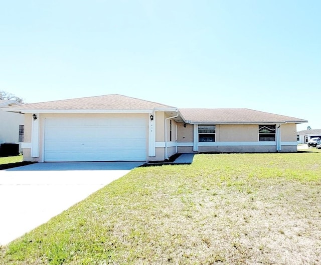 single story home featuring a garage, central air condition unit, and a front yard