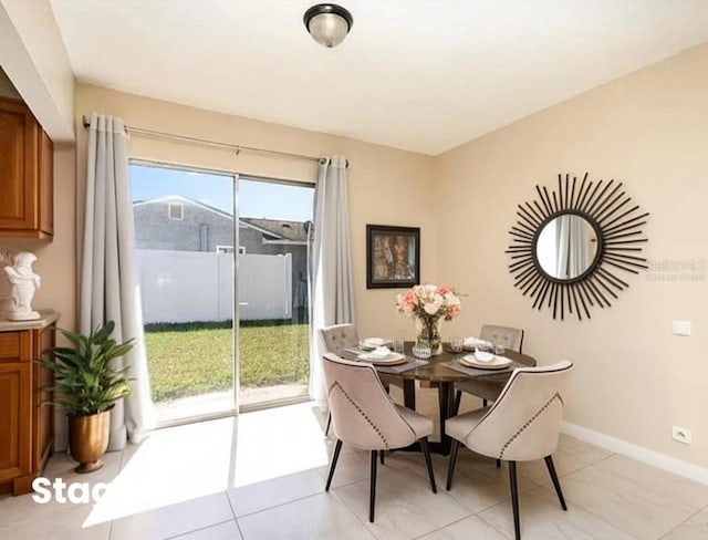 dining area featuring baseboards